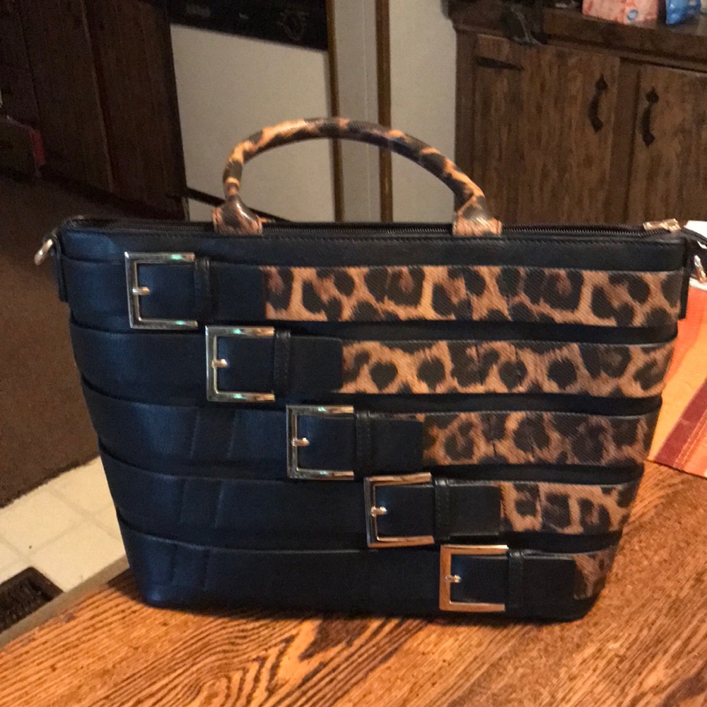 Large purse with buckles n tiger bands around it